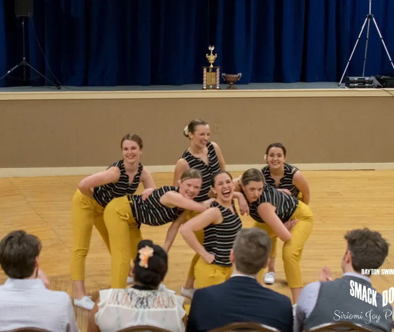 Team picture of the Tri-City Six, posing at the end of the routine